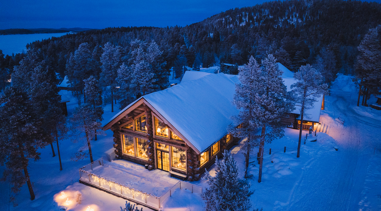Winter cabins and lit windows in the Finnish north
